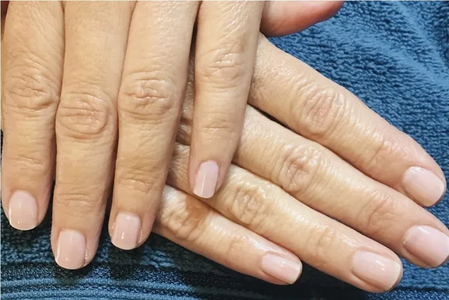 Freshly done basic manicure with natural polish