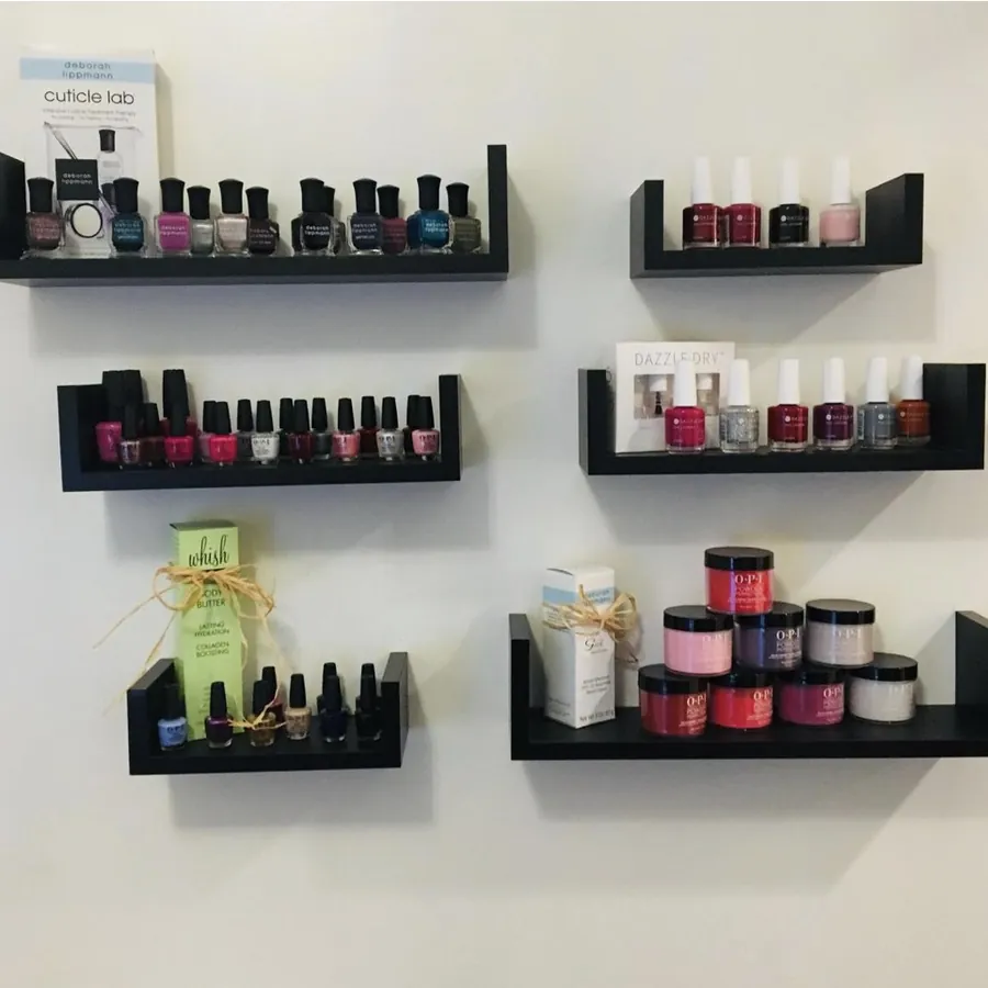 Shelves of nail polish and organic Whish and Gehwol products at Beccas Nails